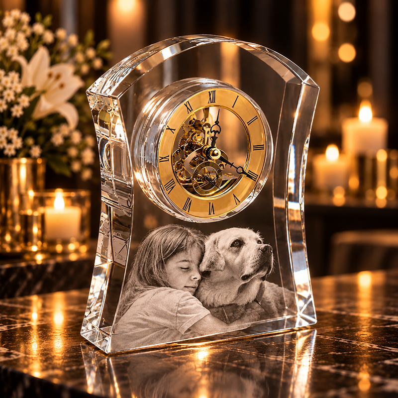 Crystal clock keepsake featuring a photo of a child hugging a dog, on a marble surface with candlelight in the background.