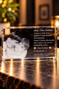 Crystal keepsake plaque with a black-and-white photo of two children and a Slovak birthday message: 'Milý Ocko, Dedinko... Prajeme ti všetko len to najlepšie k Tvojim krásnym 60. narodeninám.' on a reflective surface.